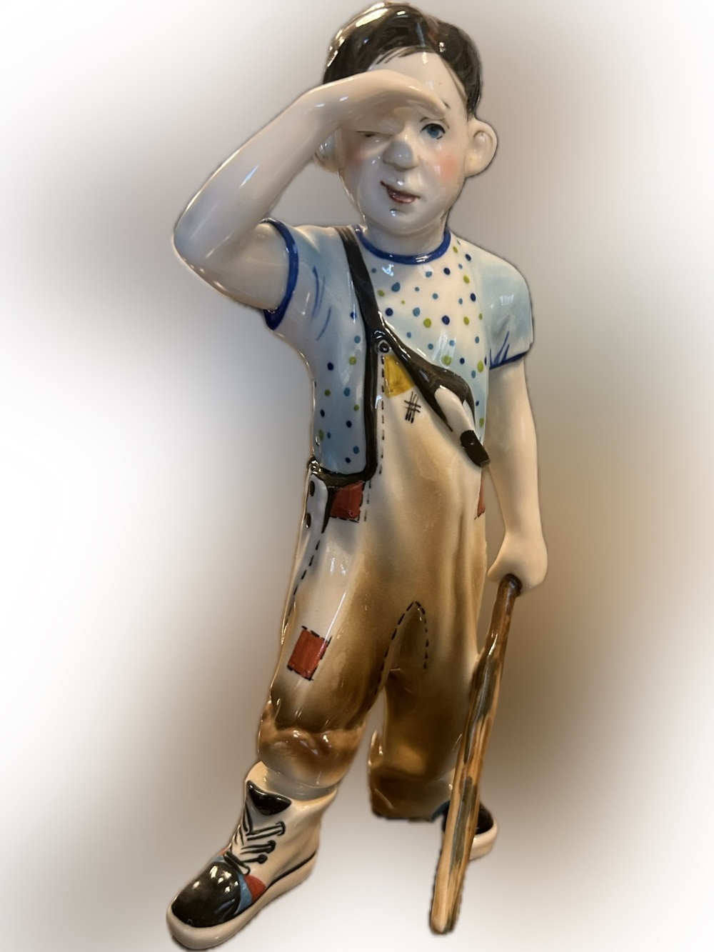 Hand-Painted porcelain Boy Figurine in White, Blue and Brown